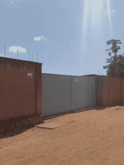 Secure vehicle storage facility with fencing and gate