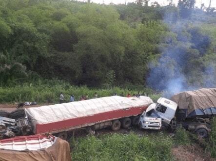 Two collided trucks being assessed for recovery in the DRC