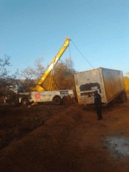 911 recovering truck and attached container